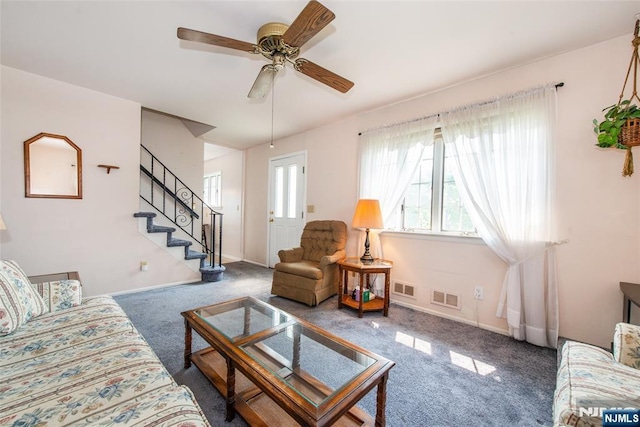 744 9th St, Carlstadt, NJ 07072 - carpeted living area with a ceiling fan and stairs