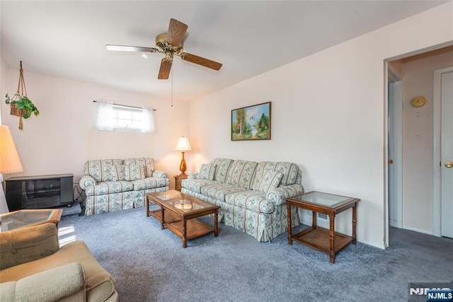 744 9th St, Carlstadt, NJ 07072 - carpeted living room featuring ceiling fan