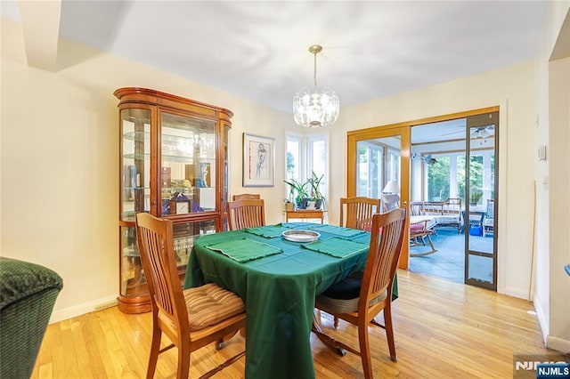28 Urma Pl, Bloomfield, NJ 07003 - dining space with light wood finished floors and a chandelier