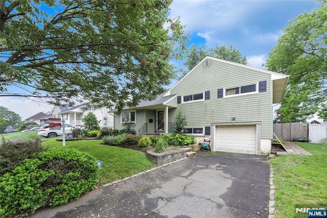28 Urma Pl, Bloomfield, NJ 07003 - split level home featuring a garage and asphalt driveway
