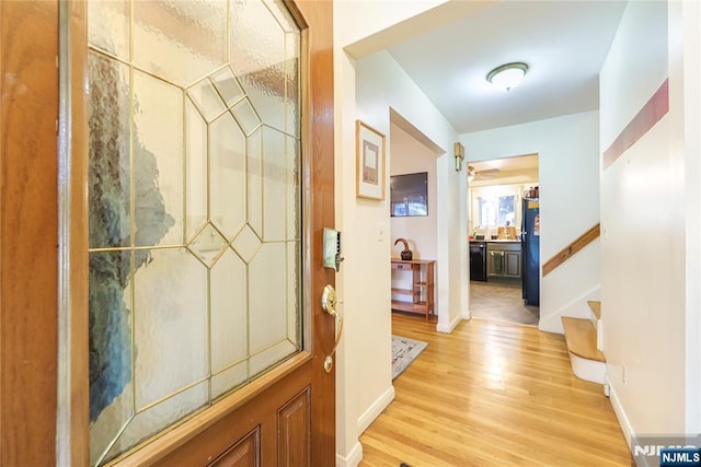 28 Urma Pl, Bloomfield, NJ 07003 - hallway with light wood-style floors and stairway
