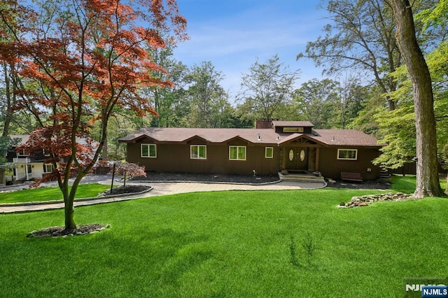 550 Dorchester Dr, River Vale, NJ 07675 - view of front of house with a front lawn and a chimney