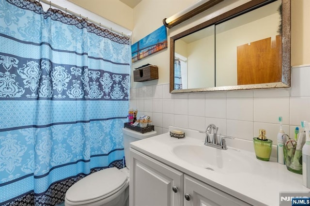 105 Old Hoboken Rd, Hackensack, NJ 07601 - full bath with tile walls, vanity, a shower with shower curtain, and backsplash