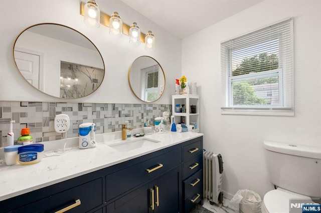105 Old Hoboken Rd, Hackensack, NJ 07601 - full bathroom featuring radiator heating unit, vanity, decorative backsplash, and a shower