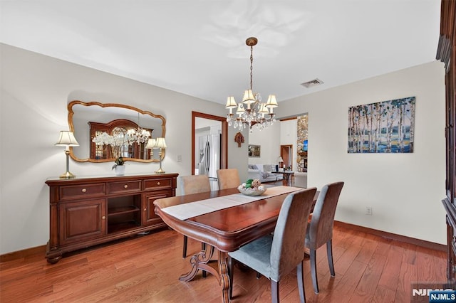 11 Country Ln, Mahwah, NJ 07430 - dining space featuring a chandelier and light wood-type flooring