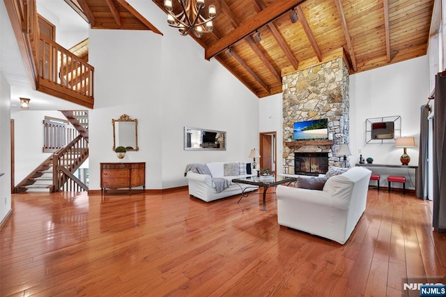 11 Country Ln, Mahwah, NJ 07430 - living room with a wood ceiling with exposed beams, stairway, a chandelier, high vaulted ceiling, and hardwood / wood-style floors