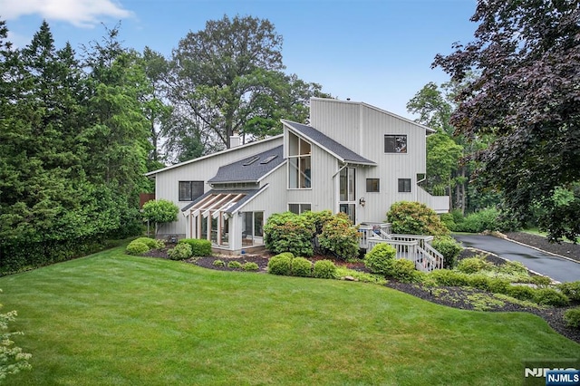 11 Country Ln, Mahwah, NJ 07430 - back of house with a lawn and driveway