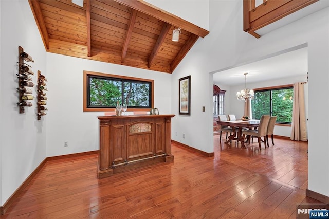 11 Country Ln, Mahwah, NJ 07430 - home office with hardwood / wood-style floors, a chandelier, a wooden ceiling with exposed beams, and high vaulted ceiling