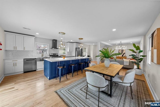 222 4th St, Ridgefield Park, NJ 07660 - dining room with a chandelier, light wood-style flooring, and recessed lighting