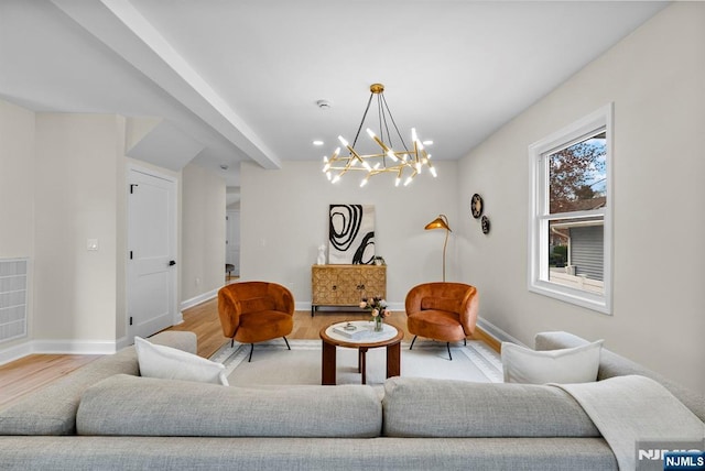 222 4th St, Ridgefield Park, NJ 07660 - living room featuring light wood-style floors, a chandelier, and recessed lighting