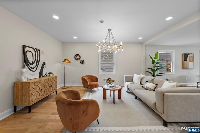 222 4th St, Ridgefield Park, NJ 07660 - living room featuring light wood finished floors, recessed lighting, and a chandelier