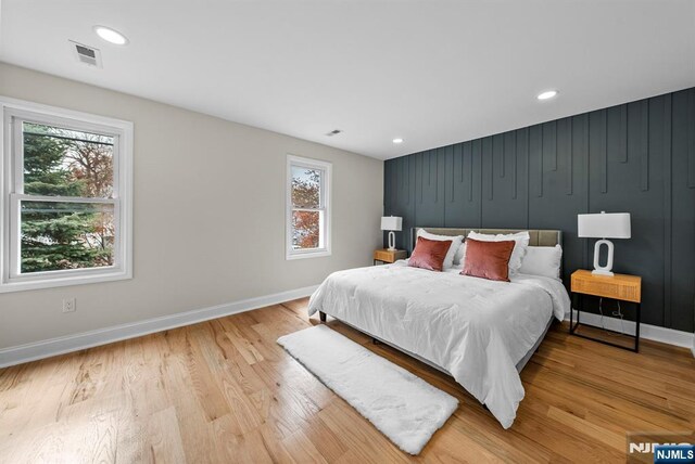222 4th St, Ridgefield Park, NJ 07660 - bedroom featuring multiple windows, light wood finished floors, and recessed lighting