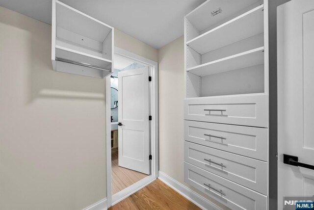 222 4th St, Ridgefield Park, NJ 07660 - walk in closet featuring light wood-style flooring
