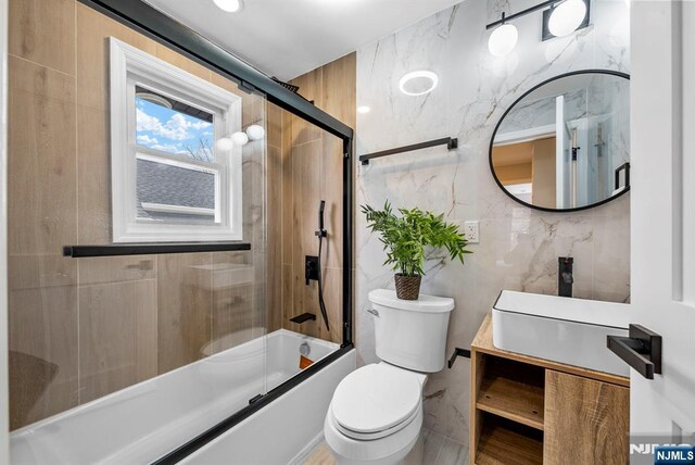 222 4th St, Ridgefield Park, NJ 07660 - bathroom with enclosed tub / shower combo, vanity, and tile walls