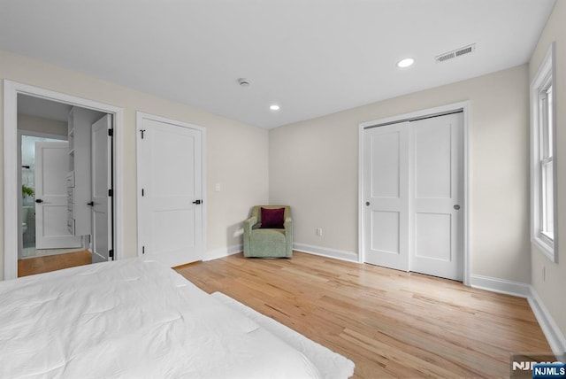 222 4th St, Ridgefield Park, NJ 07660 - bedroom with wood finished floors, recessed lighting, and ensuite bathroom