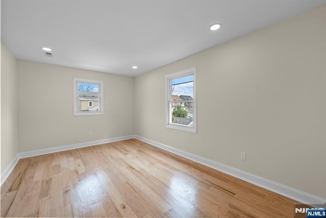 222 4th St, Ridgefield Park, NJ 07660 - spare room with healthy amount of natural light, wood finished floors, and recessed lighting