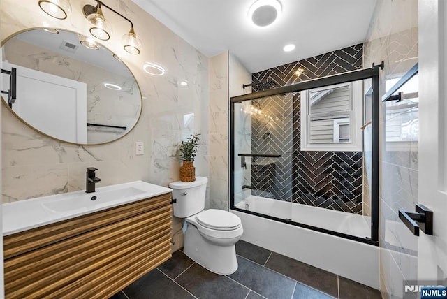 222 4th St, Ridgefield Park, NJ 07660 - full bathroom with vanity, combined bath / shower with glass door, tile walls, and tile patterned floors