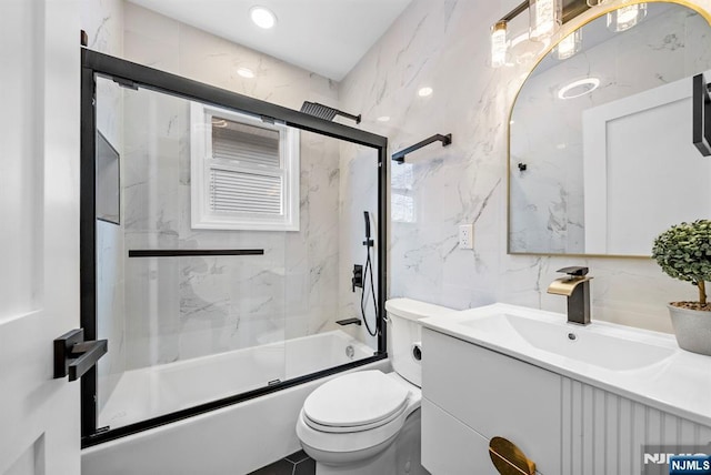 222 4th St, Ridgefield Park, NJ 07660 - full bathroom featuring tile walls, vanity, and bath / shower combo with glass door