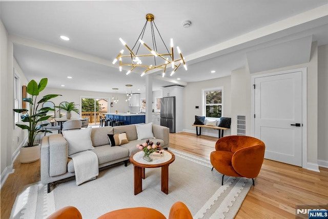 222 4th St, Ridgefield Park, NJ 07660 - living room with light wood-style flooring, healthy amount of natural light, and recessed lighting