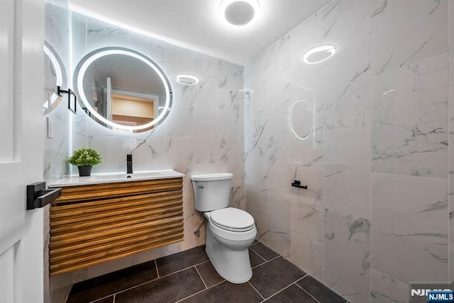 222 4th St, Ridgefield Park, NJ 07660 - bathroom featuring tile walls, vanity, and tile patterned flooring