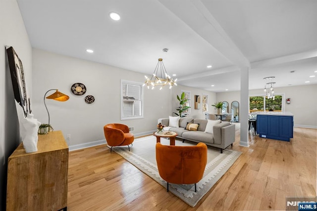 222 4th St, Ridgefield Park, NJ 07660 - living room featuring a chandelier, light wood-style flooring, recessed lighting, and beam ceiling