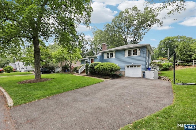 21 Valley Forge Way, Ho-Ho-Kus, NJ 07423 - split level home featuring driveway, a chimney, an attached garage, and a front yard