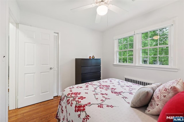 21 Valley Forge Way, Ho-Ho-Kus, NJ 07423 - bedroom featuring radiator heating unit, wood finished floors, and ceiling fan
