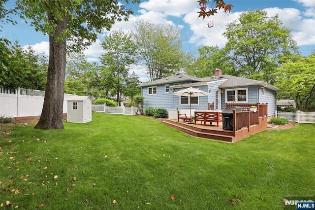 21 Valley Forge Way, Ho-Ho-Kus, NJ 07423 - rear view of property featuring a storage unit, a fenced backyard, a deck, and a chimney