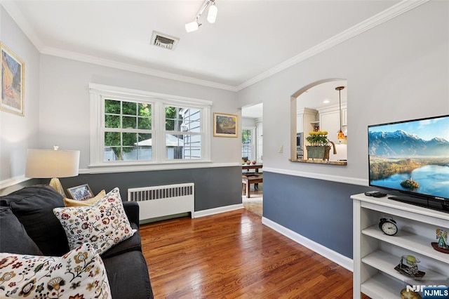 21 Valley Forge Way, Ho-Ho-Kus, NJ 07423 - living room featuring radiator heating unit, wood finished floors, and crown molding