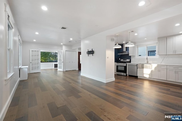 26 Amsterdam Ave, Teaneck, NJ 07666 - unfurnished living room featuring dark wood finished floors and recessed lighting