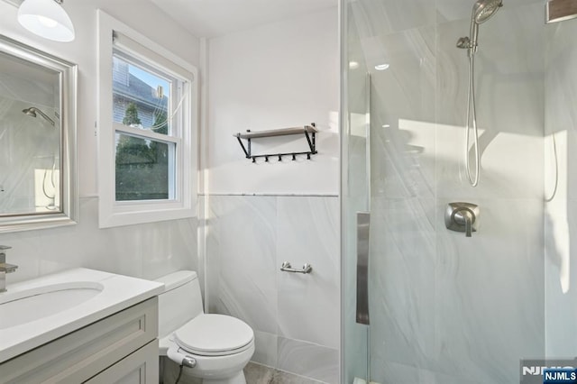 26 Amsterdam Ave, Teaneck, NJ 07666 - bathroom featuring a marble finish shower, vanity, and tile walls