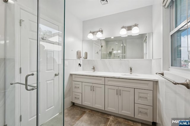26 Amsterdam Ave, Teaneck, NJ 07666 - bathroom featuring a stall shower and double vanity