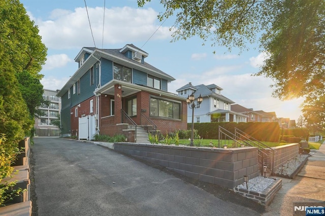 26 Amsterdam Ave, Teaneck, NJ 07666 - american foursquare style home featuring brick siding
