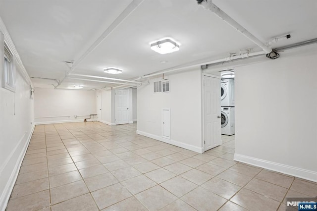26 Amsterdam Ave, Teaneck, NJ 07666 - finished basement with stacked washing machine and dryer and light tile patterned floors