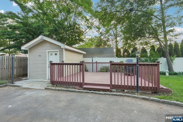26 Amsterdam Ave, Teaneck, NJ 07666 - deck with a fenced backyard, an outbuilding, and a patio area