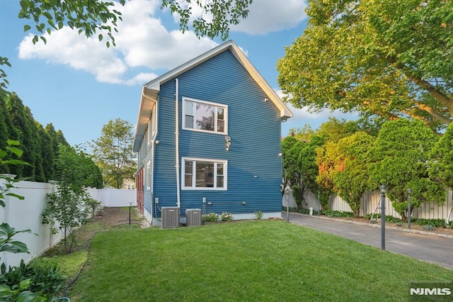 26 Amsterdam Ave, Teaneck, NJ 07666 - view of side of home with a fenced backyard and a cooling unit