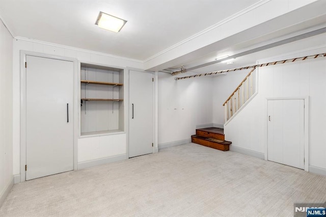286 Willow Ave, Lyndhurst, NJ 07071 - finished basement with carpet flooring, stairs, and ornamental molding