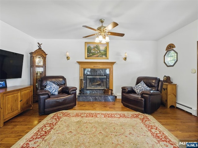36 First, Hawthorne, NJ 07506 - living area with a baseboard radiator, ceiling fan, and wood finished floors