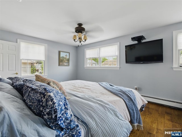 36 First, Hawthorne, NJ 07506 - bedroom featuring a baseboard heating unit, wood finished floors, and a ceiling fan