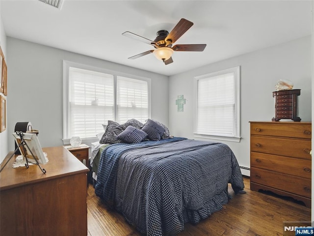 36 First, Hawthorne, NJ 07506 - bedroom featuring hardwood / wood-style floors, baseboard heating, and a ceiling fan