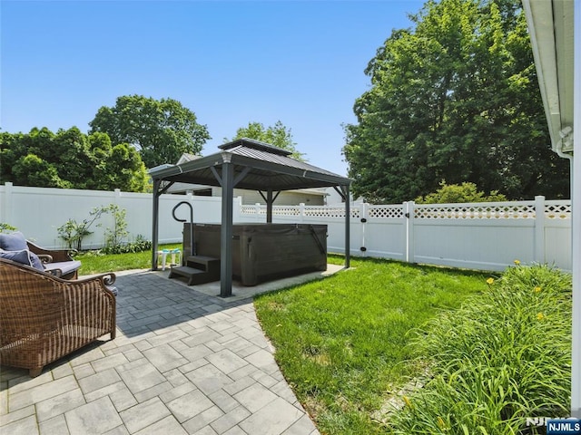 36 First, Hawthorne, NJ 07506 - fenced backyard featuring a hot tub, a patio, and a gazebo