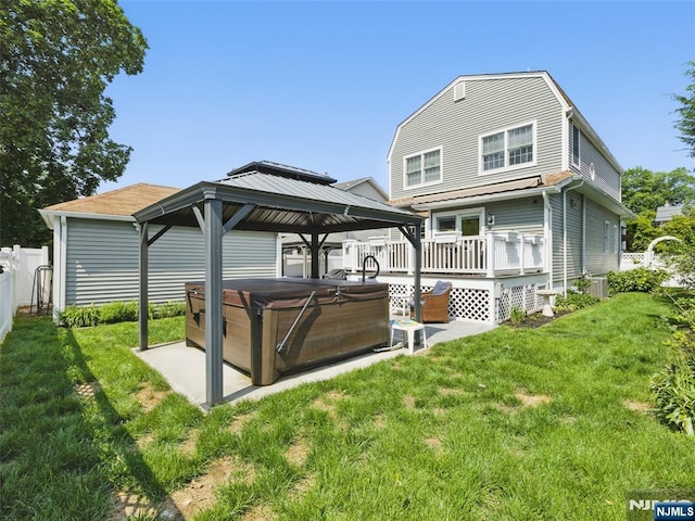 36 First, Hawthorne, NJ 07506 - back of house featuring a hot tub, a gazebo, and a deck