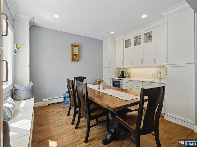 36 First, Hawthorne, NJ 07506 - dining room featuring wine cooler, baseboard heating, recessed lighting, wood finished floors, and bar