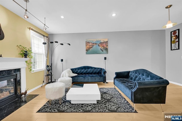 303 Wilshire Dr, Nutley, NJ 07110 - living room with a fireplace, wood finished floors, and recessed lighting