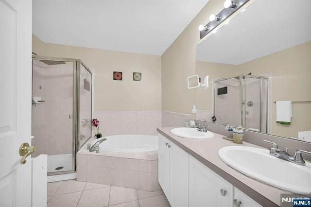 303 Wilshire Dr, Nutley, NJ 07110 - full bath with a stall shower, a garden tub, double vanity, and tile patterned flooring
