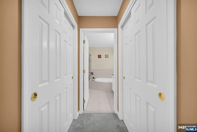 303 Wilshire Dr, Nutley, NJ 07110 - corridor with carpet floors and tile patterned flooring