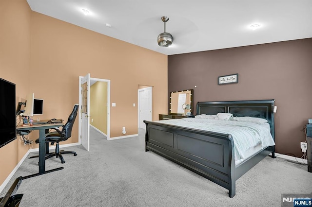 303 Wilshire Dr, Nutley, NJ 07110 - carpeted bedroom with a desk and a high ceiling