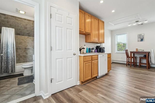 322 3rd St, Saddle Brook, NJ 07663 - kitchen with dishwasher, light countertops, light wood-type flooring, recessed lighting, and baseboard heating