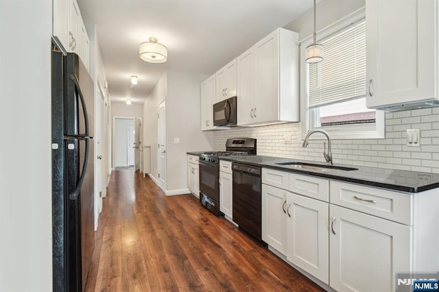 322 3rd St, Saddle Brook, NJ 07663 - kitchen featuring black appliances, decorative backsplash, and white cabinets