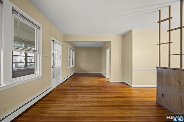 115 12th St, Prospect Park, NJ 07508 - hall featuring baseboard heating, a baseboard radiator, and wood finished floors